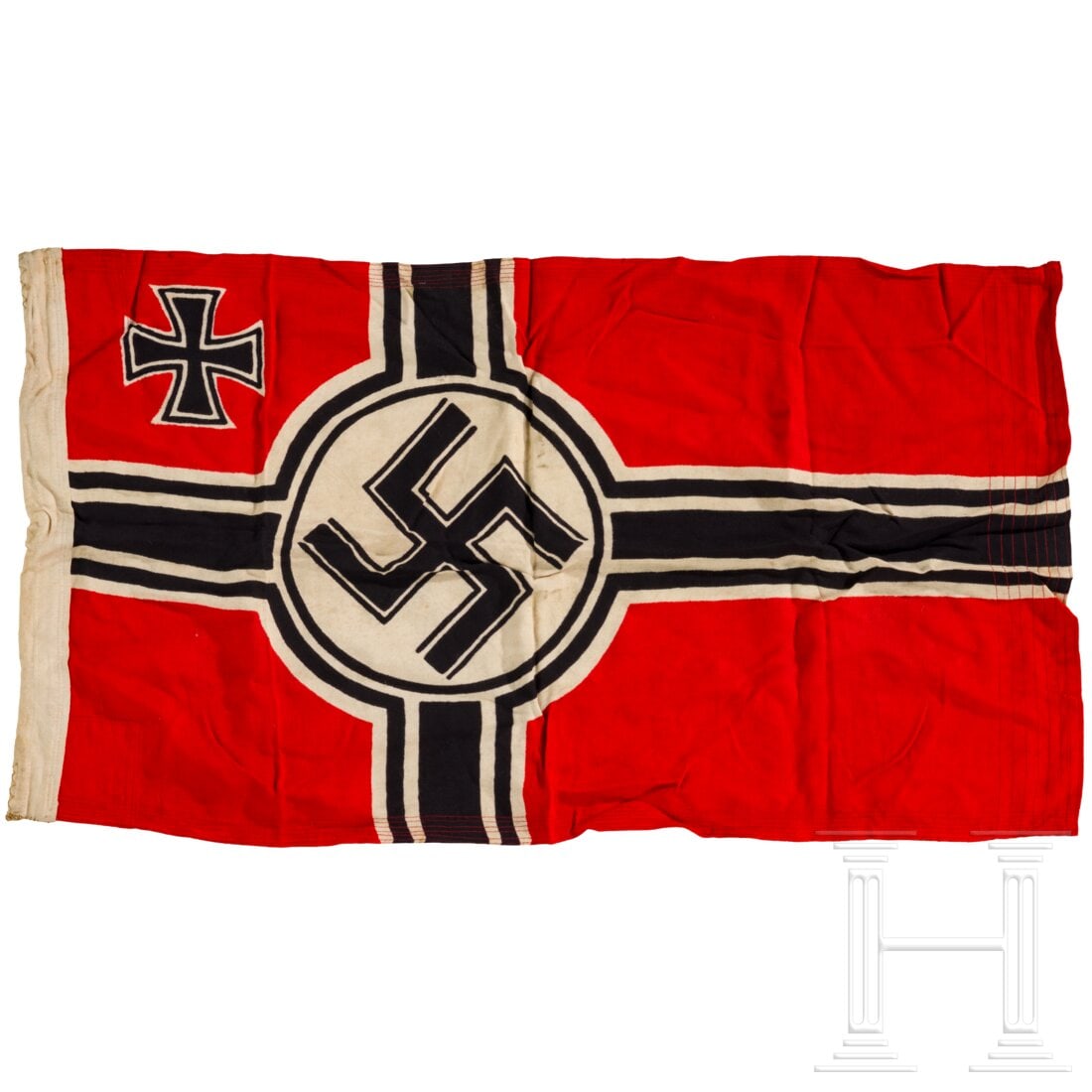 A small Reich war flag: A small Reich war flagBeidseitig farbig bedrucktes Marinefahnentuch, die Randverstärkung mit Stempel "Kr.Fl. 50 x 85" und unleserlich "Johann Liebieg... Reichenberg..."? Die Befestigungsschlaufen
