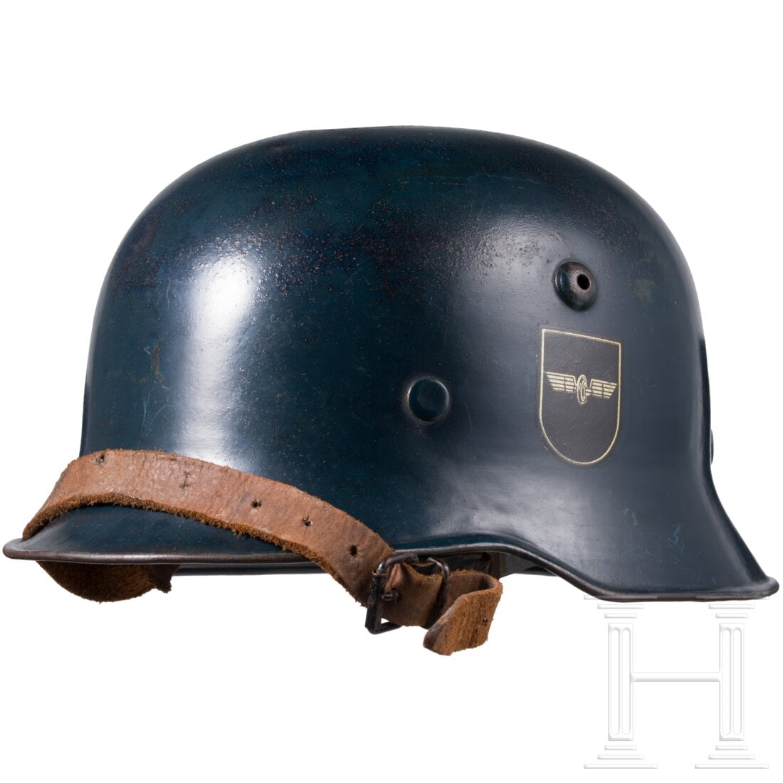 A double decal steel helmet for railway protection service: A double decal steel helmet for railway protection service Dunkelblau überlackierte Eisenglocke (flugrostig), ein ziviles Model mit kantig abgesetztem Vorderschirm, innenseitig die ursprüngliche gr�
