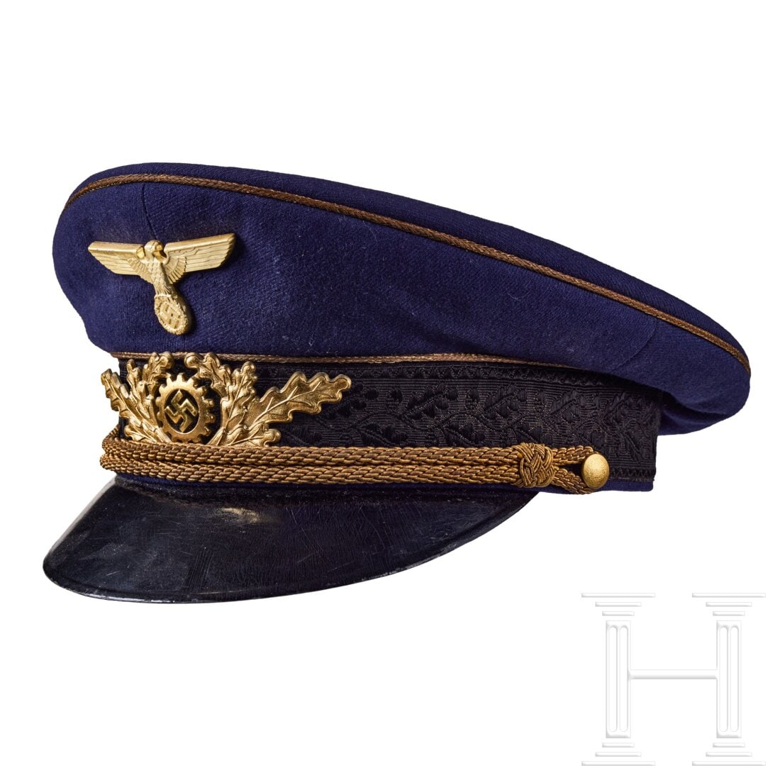 A Visor Cap for German Labor Front (DAF) High Leader: A Visor Cap for German Labor Front (DAF) High LeaderCap body in dark blue tricot wool, black silk cap band with woven oakleaf pattern, gilt piping, gilt chin cords attached by two gilt finish pebbled 