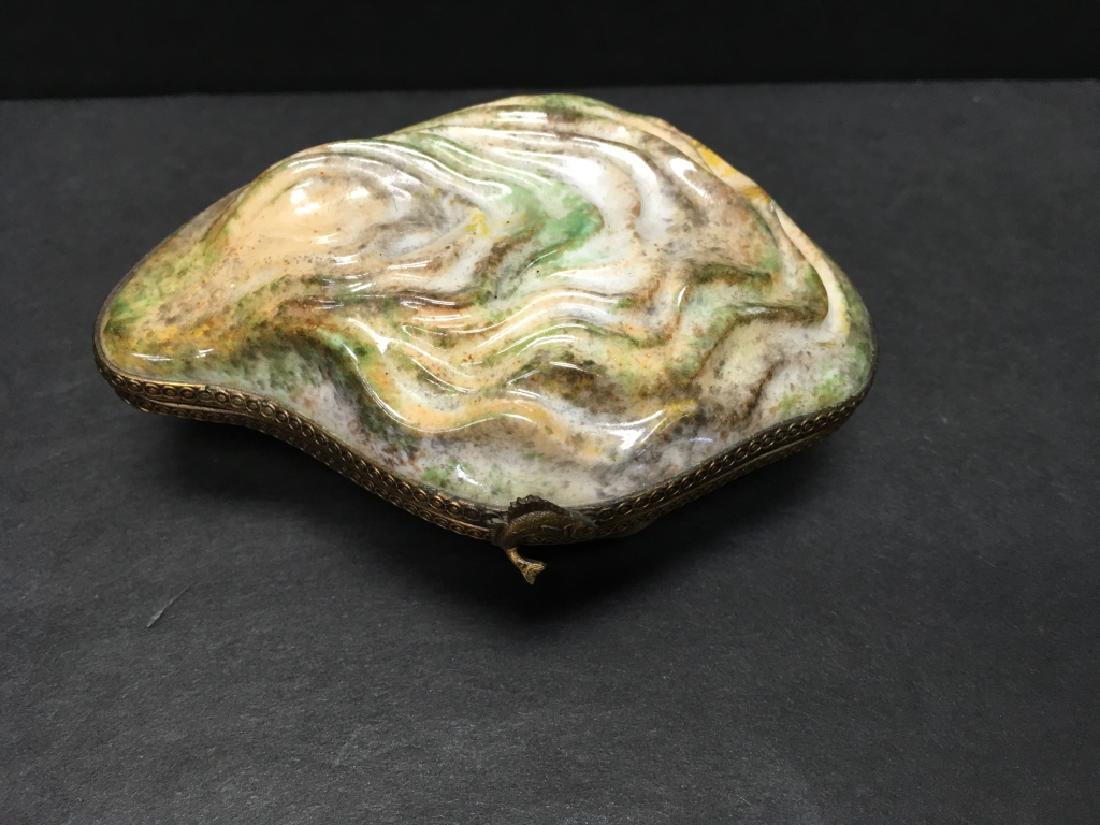 Limoges Oyster with a Pearl Inside Box: Oyster box in shades of greens, cream and brown with a fish.Signed Peint mainLimoges FranceChamille N932