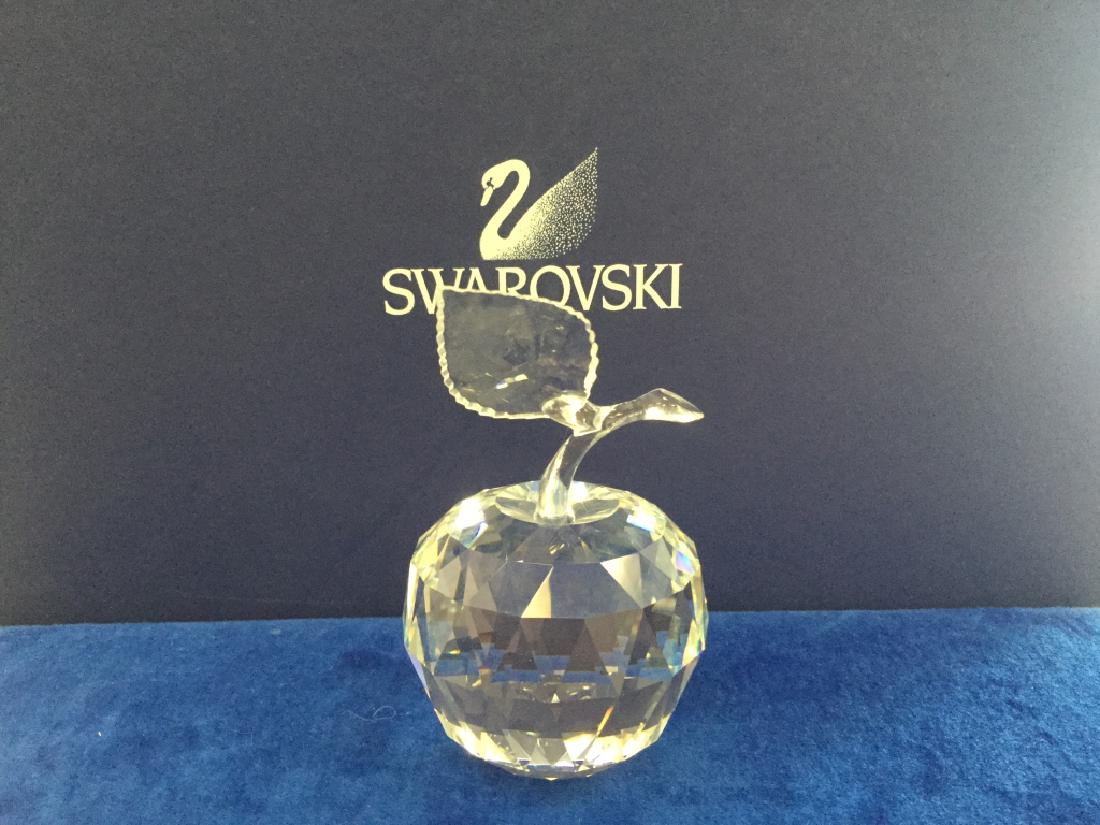 Swarovski Apple: Apple: This figure is part of the "Sparkling Fruit" theme group. The apple, stem and leaf are all crystal. The Swarovski mark can be found on either the leaf or the fruit. This piece was introduced in