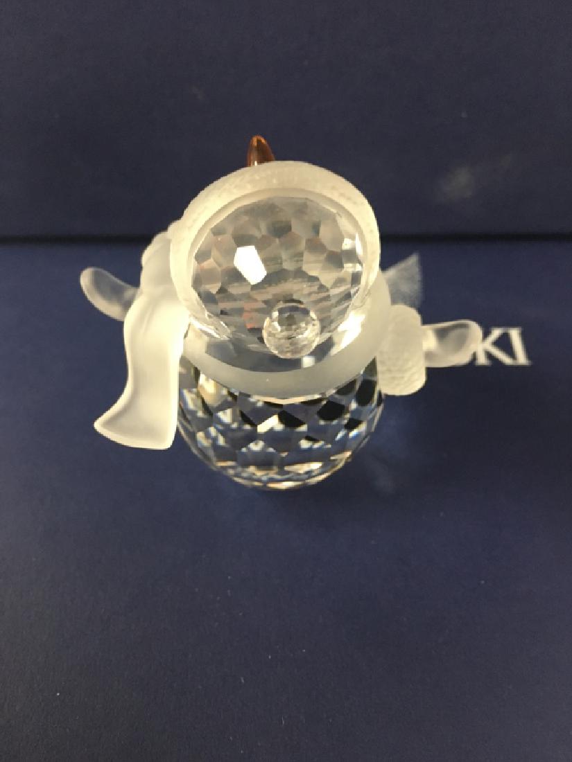 Swarovski Snowman with Scarf and Hat- Retired: Adorable Swarovski Crystal Snowman designed by Edith Mair. This figurine features an orange colored carrot nose and jet black colored eyes and buttons; frosted hat, face, scarf and mittens! What a cut