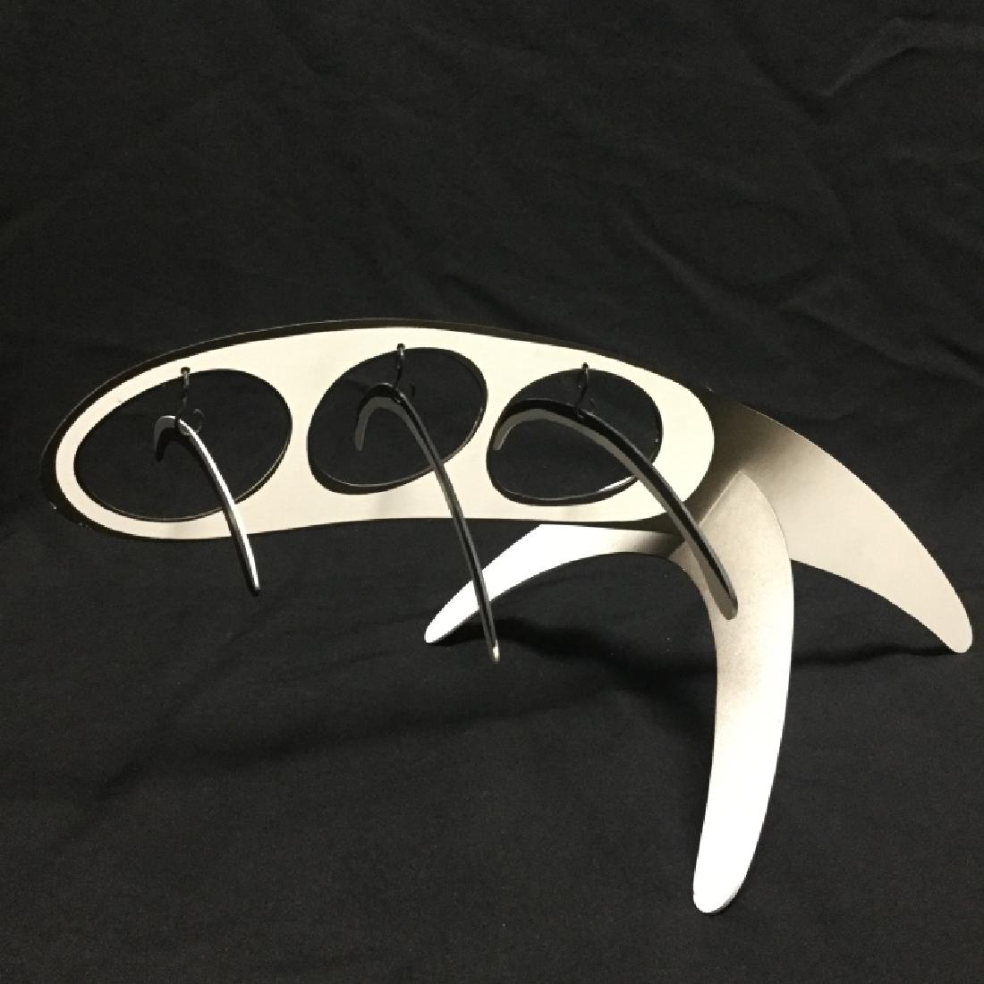 Signed Kinetic Mobile Sculpture by Brad Howe: Brad Howe, American, b. 1959. Polychrome metal kinetic sculpture in black and white, Signed on rear leg extension. Valued at 1500.00 USDMeasures: 7" H x 19" W x 11" D