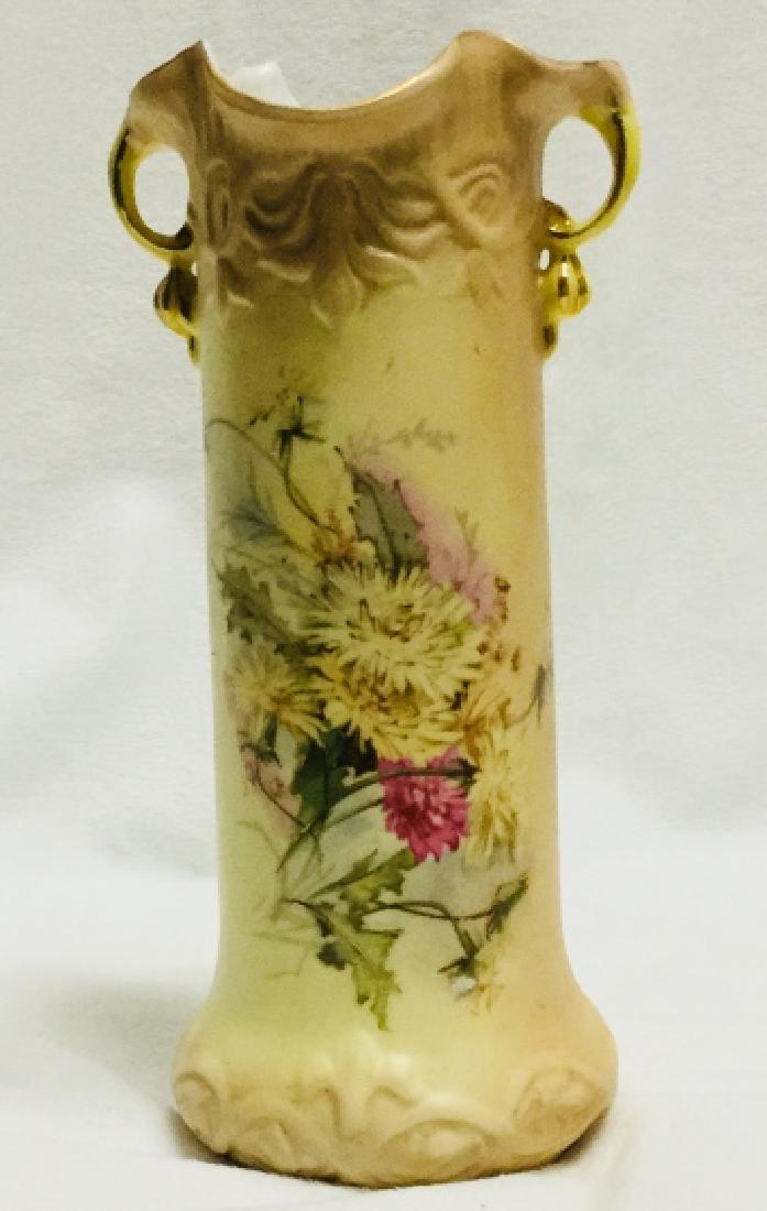 ROYAL RUDOLSTADT PORCELAIN FLORAL VASE: Royal Rudolstadt porcelain vase with floral design, on each side is a loop handle to bottom is marked RW. Measures approx 8 1/2" tall. Very good conditon.