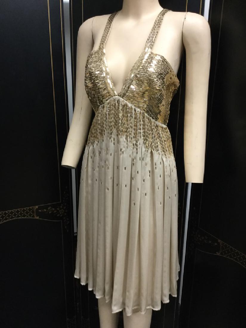 NEW ROBERTO CAVALLI GOLD SEQUIN COCKTAIL DRESS 40: Roberto Cavalli tan georgette cocktail dress with gold sequin trim detail. Camisole straps and bare back design. Size 40 on tag. NEW with tags.