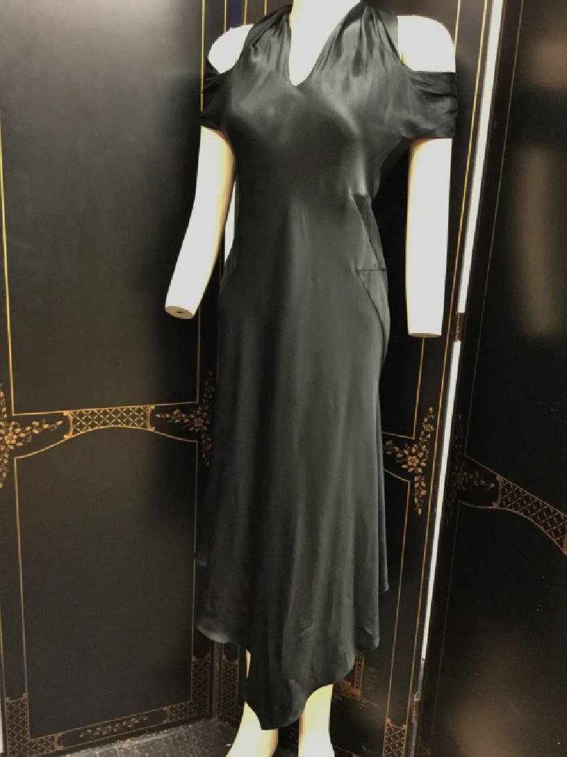 VIONNET BLACK SILK SPDX OPEN SHOULDER EVE DRESS 38: Vionnet designer gown. Silk spandex material with twist around open shoulder famed detail. Size ladies 38. Excellent pre-owned condition.