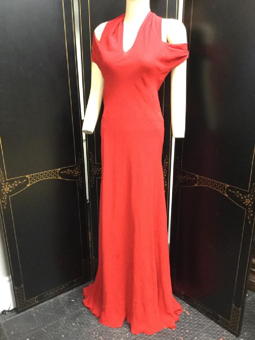 VIONNET RED SILK SPDX OPEN SHOULDER GOWN 38: Vionnet red silk spandex slinky gown. Twist open shoulder detail. Note this dress has some spots and marks from handling in store. Overall good condition noting spotting. Size ladies 38.