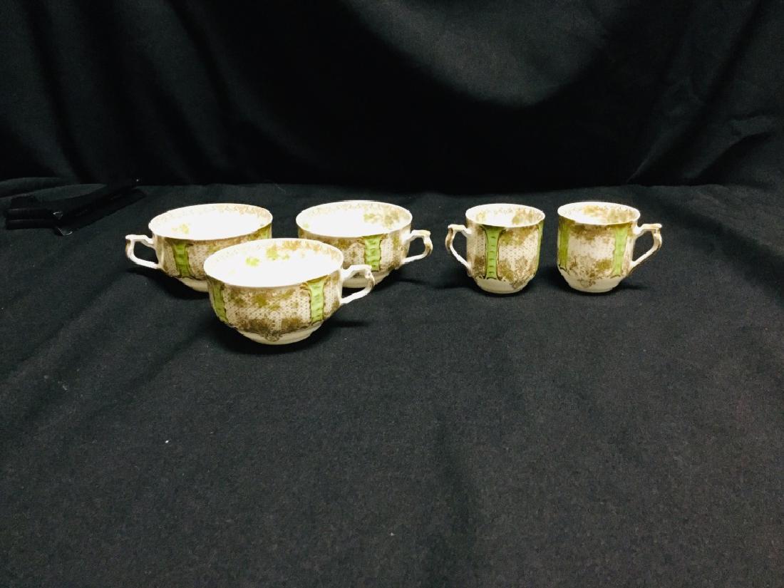 ANTIQUE LIMOGES HAVILAND TEA & ESPRESSO CUPS: Antique Limoge Haviland small tureen with Green Panels & Roses Motiff.-3 tea cups measuring approx 3 1/2" tall x 3 1/2" wide.-2 espresso cups measuring approx 2" tall x 3" wide. Great condition on the