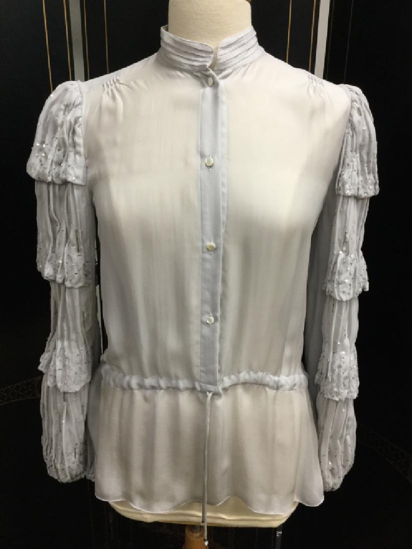 NEW ROBERTO CAVALLI VICTORIANA LACE SLV BLOUSE 40: Roberto Cavalli new with tags beautiful soft gray silk blouse with lace layered sleeves. High neck style for a victoriana look. Ladies size 40. NEW with tags.