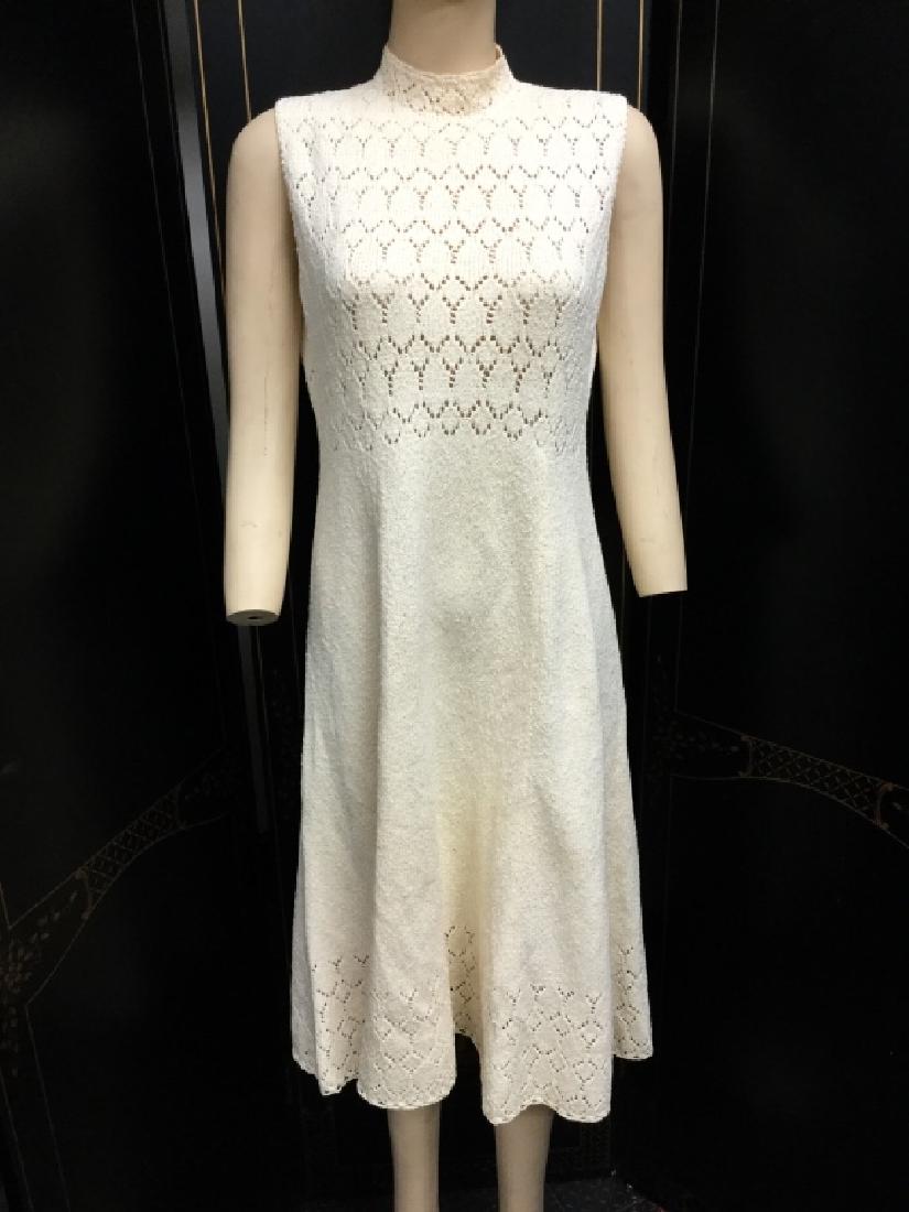 VINTAGE 60S PICARDO KNITS CREAM CROCHET LACE DRESS: Crochet lace knit dress from the 60's era. Fit flare sleeveless design. Sleek and phenomenal to wear. By Picardo Knits, no size tag but will fit a size 8 to 10 in modern sizing Medium. Some rust ish c