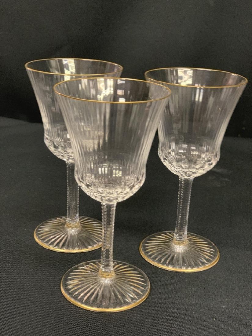 3 SAINT LOUIS "APOLLO GOLD" BURGUNDY WINE GLASSES: Etched crystal wine glasses rimmed in 24kt gold. Approximately 6.5" tall. Pattern is "Apollo Gold". Size indicates "Burgundy Wine". Made in France. About Saint Louis Crystal: Made exclusively in Franc