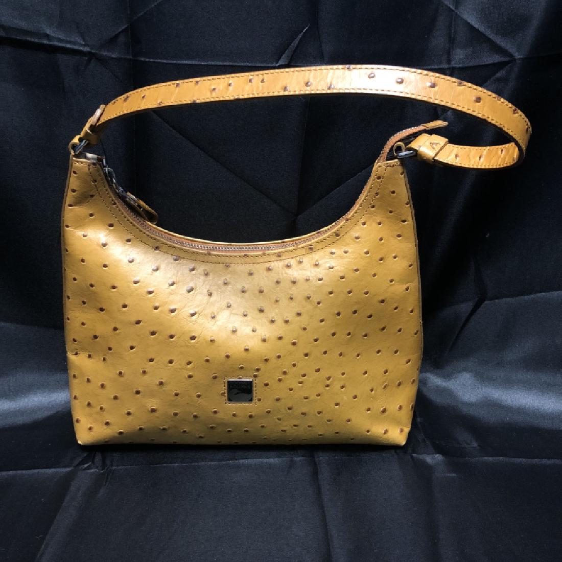 DOONEY & BOURKE OSTRICH HOBO PURSE BAG: Great Dooney & Bourke piece! Crafted in butterscotch ostrich leather, this is a classic piece of Dooney. Clean lines with a curving zip closure at the top, “hobo” style. Interior zip compa