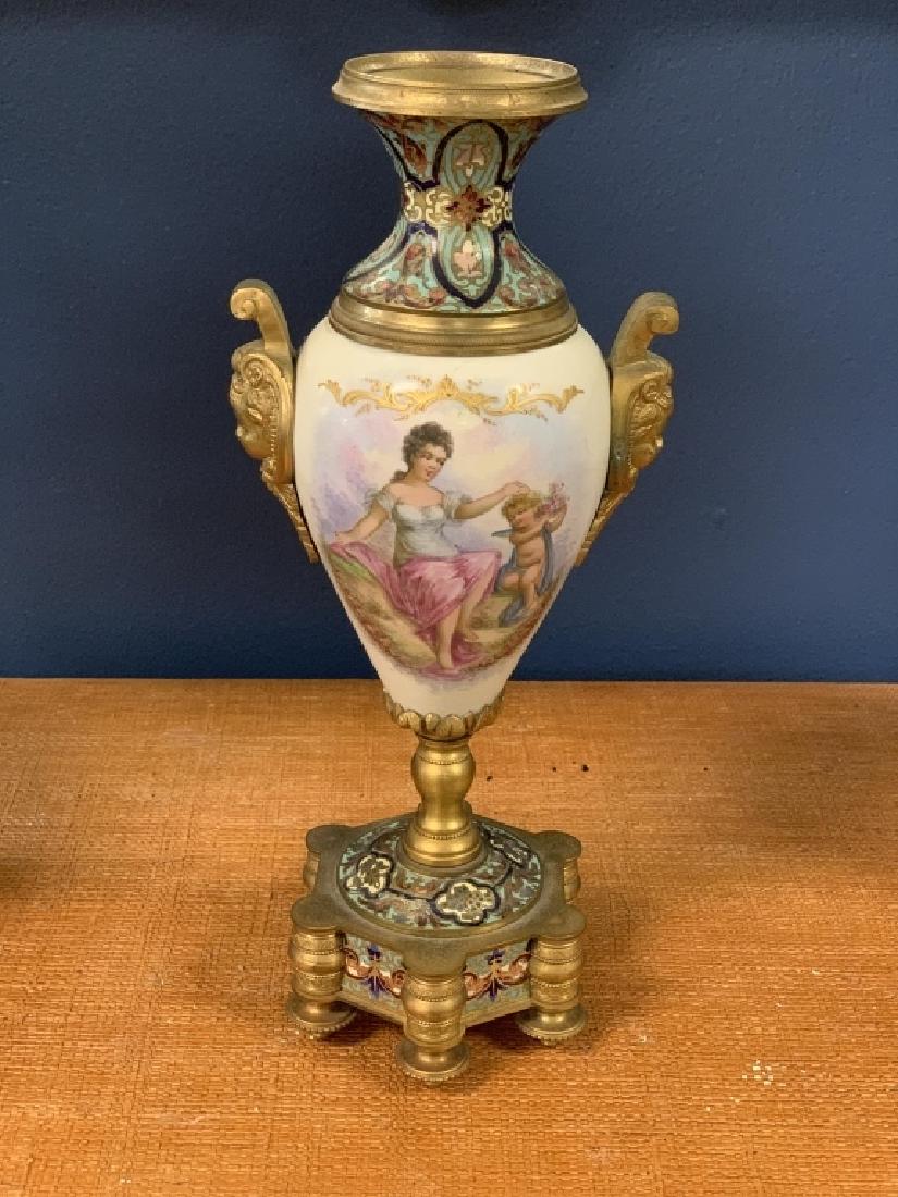 SERVES FRANCE RENAISSANCE BAROQUE CHERUB URN: Antique Serves French porcelain urn featuring continuous hand-painted reserve with a seated female & winged cherub on one side and a pastural vista on the other. Vibrant colors & gilt embellishments. 