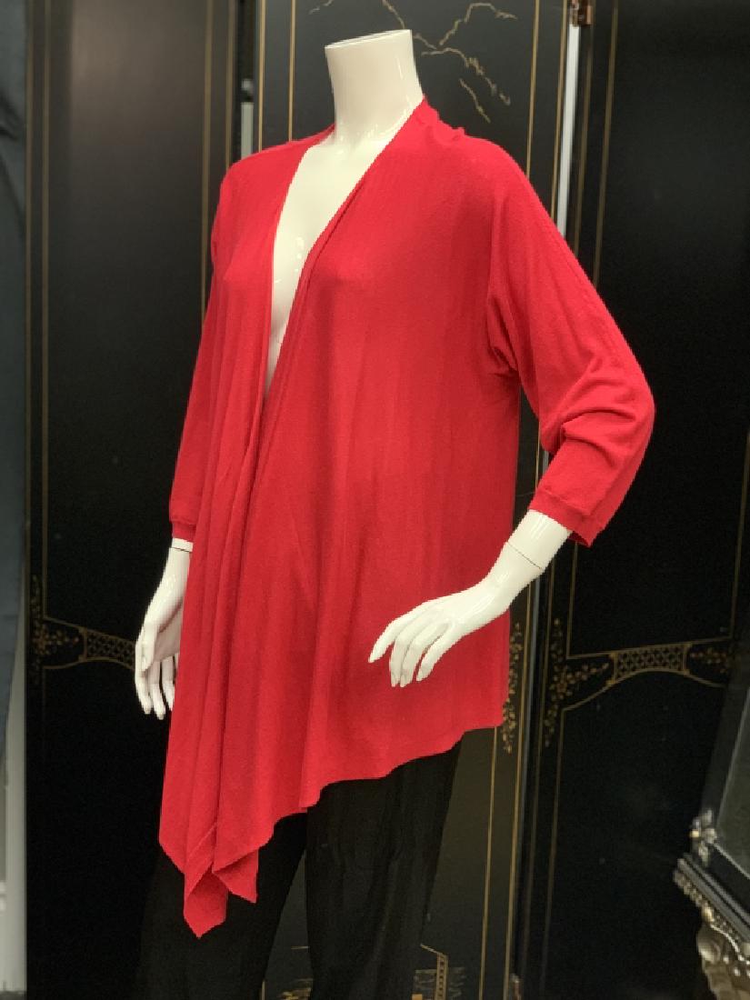 DKNY CHERRY RED WATERFALL CASHMERE CARDIGAN: Gorgeous piece from DKNY. Designed in cherry red, this has an open front that cascades past the hips. Crafted in pure, baby soft cashmere, this will make a terrific addition to any high-end wardrobe.