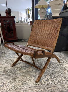 RARE HANS WEGNER MID CENTURY FOLDING CHAIR: HANS WEGNER (1914 - 2007)Folding chair, Denmark, ca. 1950Oak, cane30 1/2" x 24" x 29 1/2" Dark patina to original finish evenly throughout