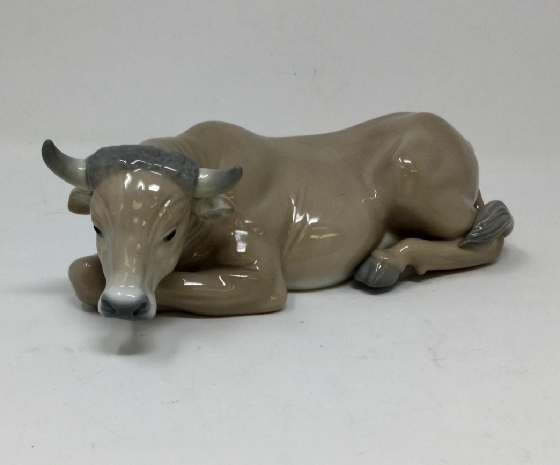 LLADRO PORCELAIN LARGE COW LAYING DOWN: Measures 9" long, has the Lladro blue stamp to base. Gloss figurine no box third party shipping required