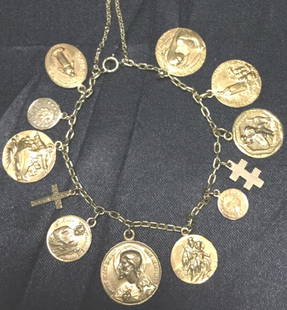 RARE CARTIER 14K GOLD RELIGIOUS CHARM BRACELET: RARE CARTIER 14K GOLD RELIGIOUS CHARM BRACELET! Rare and hard to find! Recently sold for 10-15K! Genuine stamped Cartier and 14K on all charms, bracelet catch has stamp on ring. See all pictures for d