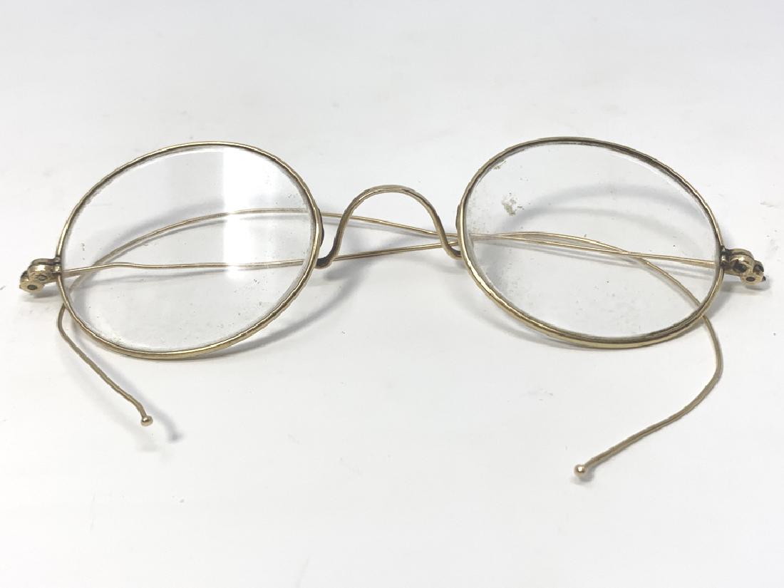 PAIR OF JOHN LENNON STYLE GOLD FILLED GLASSES: In excellent condition, they measure just under 4" in width 3rd party shipping required