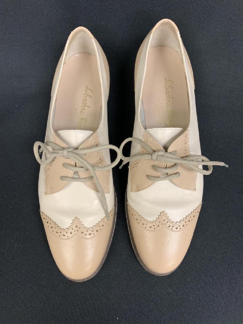 SALVATORE FERRAGAMO BEIGE OXFORD WINGTIP SHOES 6.5: Excellent pair of Salvatore Ferragamo oxford wingtips in beige & cream. Tie laces. Leather upper. Pierced trim along wingtip, heel & saddle. Mint pre-owned condition showing no flaws & very minor wear