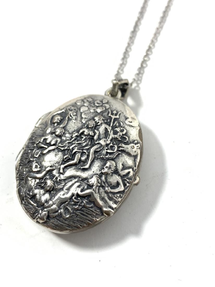 ART NOUVEAU 835 SILVER LOCKET AND CHAIN: Feature Posieidon and woman swimming in the ocean depth. Measures just over an inch oval. Has a chain marked 835 German silver. The locket is un monogramed. Total weight 26.4 grams. Dates to the 2nd q