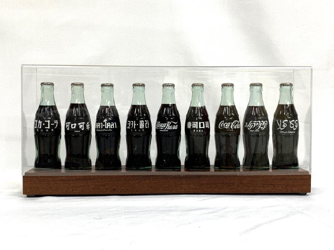 COCA COLA SET 9 INTERNATIONAL ANNIVERSARY BOTTLES (1 of 2)