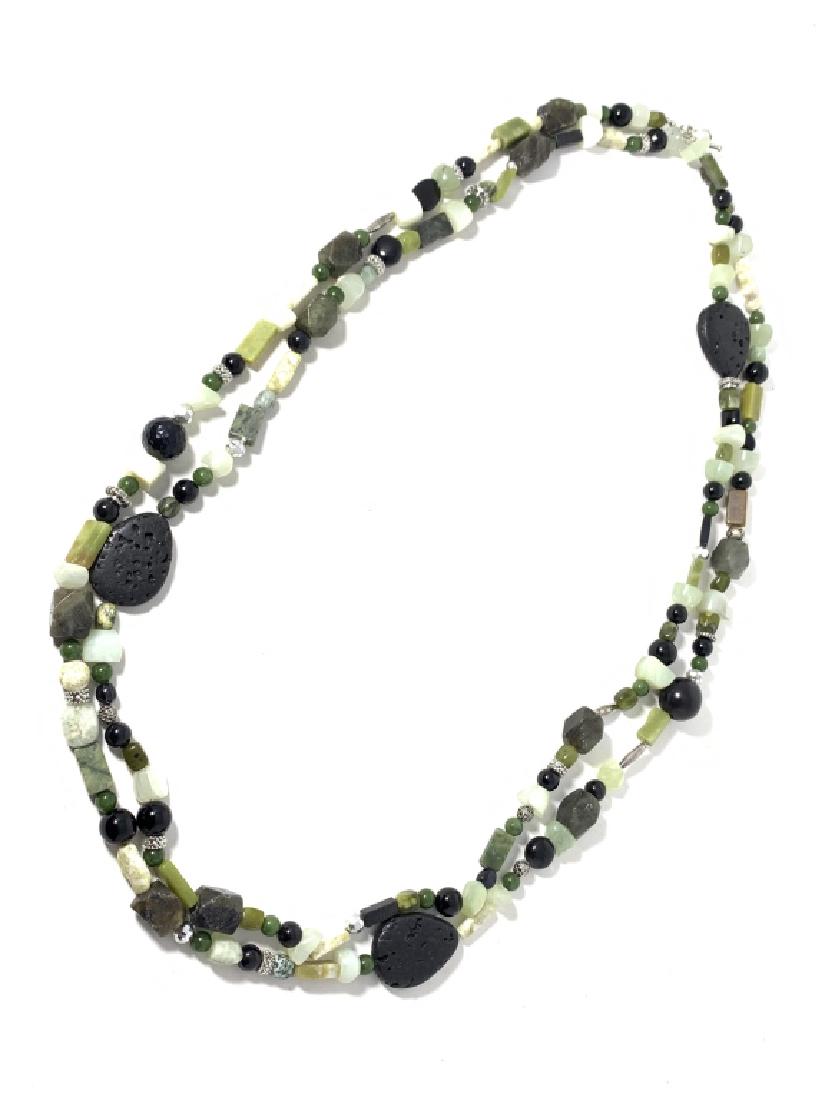 FABULOUS BEADED W/ JADE ONYX CARVED STONE NECKLACE: Double stranded necklace, measures 38" long. With Jade, onyx and other carved stones.. Property of a Palm Beach lady. Third party shipping is required