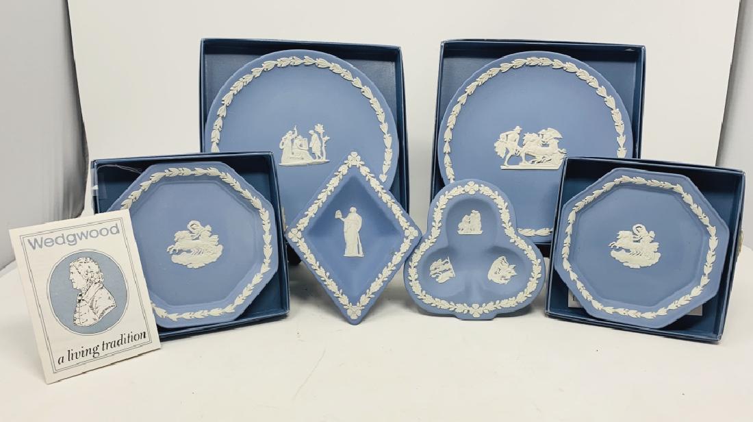 LOT OF 6 WEDGWOOD BLUE AND WHITE TRIVET TRAYS: 4 still with original boxes. Largest measures 6 1/2" in diameter. All appear to be in fine condition . Third party shipping required.