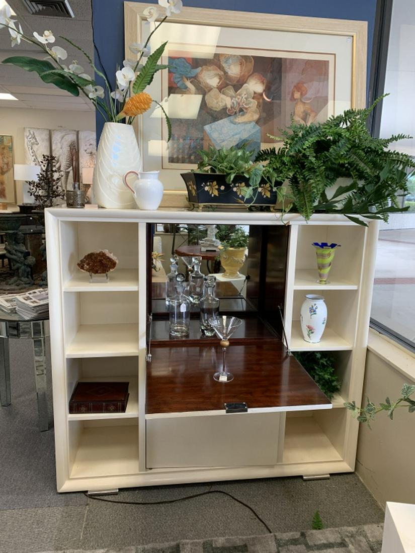 RALPH LAUREN CREAM LACQUER ONE FIFTH BAR CABINET: RALPH LAUREN CREAM LACQUER ONE FIFTH BAR CABINET Tripartite bar and display cabinet with central drop leaf mixing surface with faux shagreen front, and carousel storage below; on plinth base. Parchmen