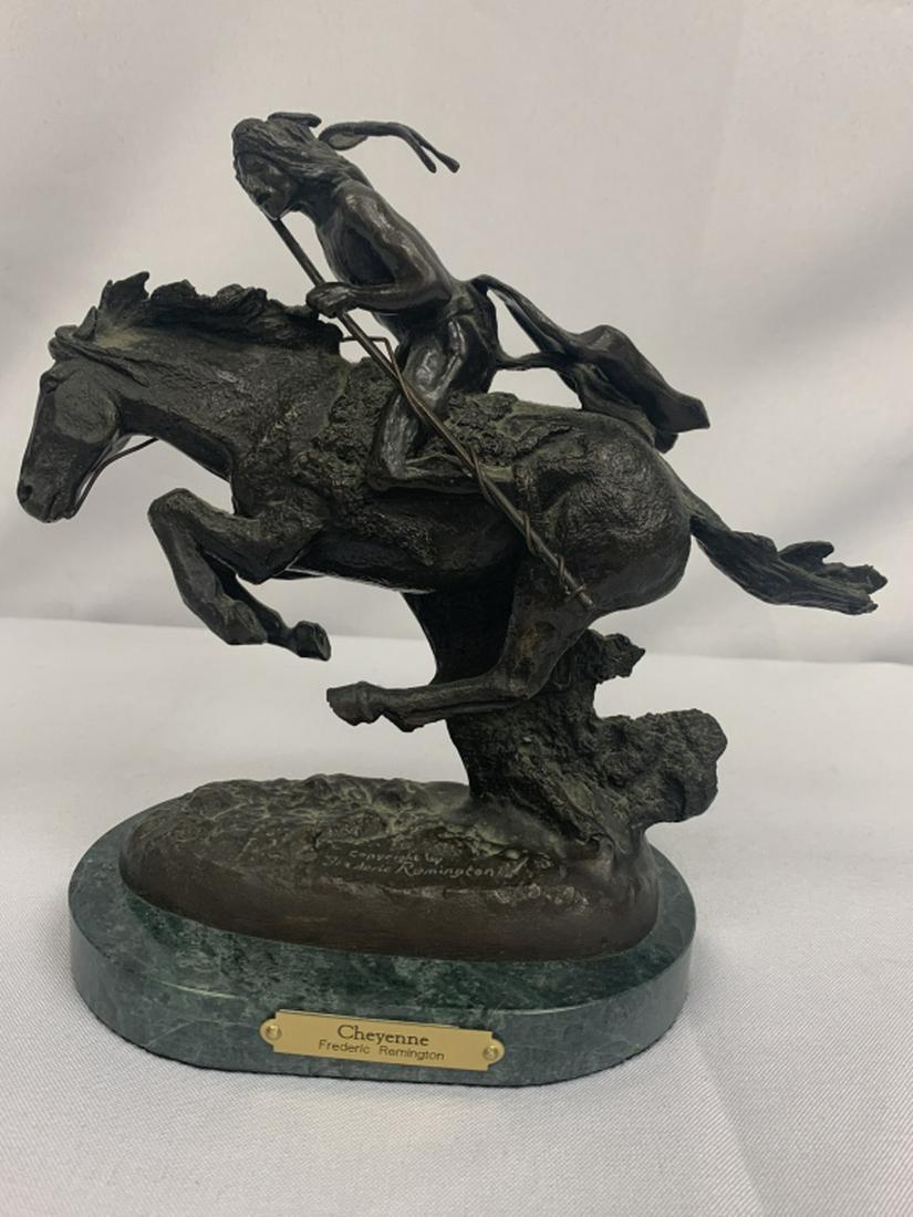 FREDERIC REMINGTON "CHEYENNE" BRONZE REPLICA: FREDERIC REMINGTON "CHEYENNE" BRONZE REPLICA The Cheyenne Sculpture by Frederic Remington depicts a member of the Cheyenne tribe riding into battle. The war-like expression of the piece resembles what