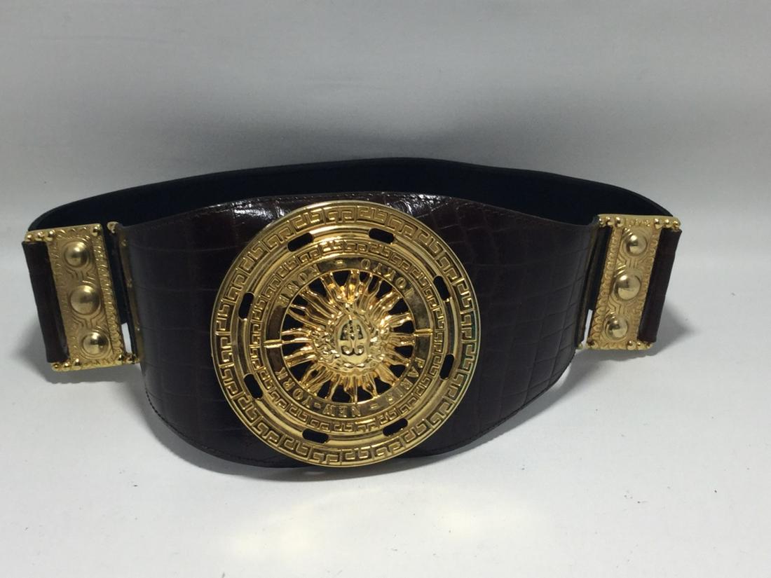 VINTAGE 80'S GOLD SUN MEDALLION ON BLACK WIDE BELT: 32" IN LENGTH. GREAT VINTAGE CONDITION.