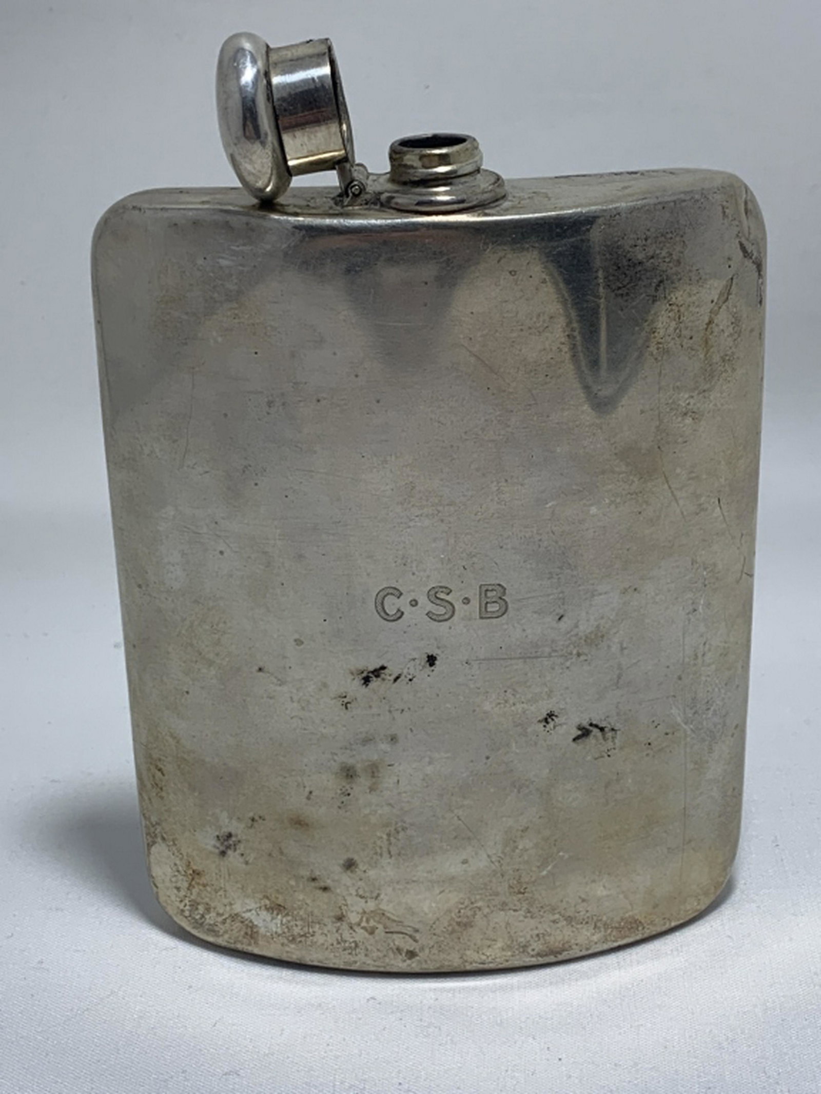 TIFFANY AND CO. STERLING FLASK: A vintage, possibly antique,Tiffany & Company flask crafted of sterling silver. Flask holds 8 Gills of fluid, approx. 32 fluid ounces. Bottom with impressed "TIFFANY & CO ?95?9 MAKERS 4894 STERLING SI