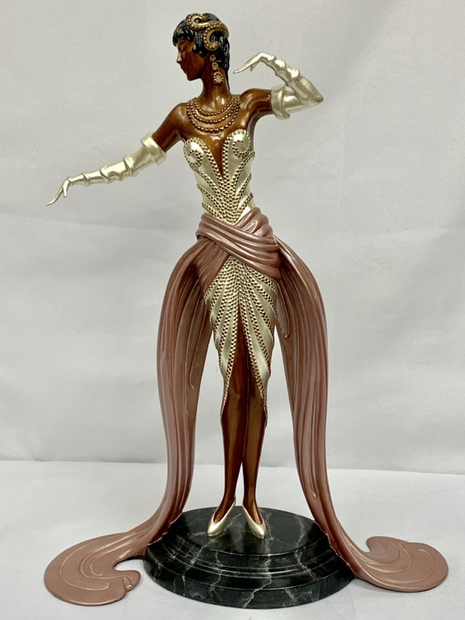 ERTE SEVENARTS LTD LIMITED EDITION BRONZE STATUE: Limited edition Erte stamped / numbered 379 / 500 and copyright year 1990. Beautiful deco lady with flapper headdress, shirred strapless cocktail dress and dramatic pink trails circling around the mar