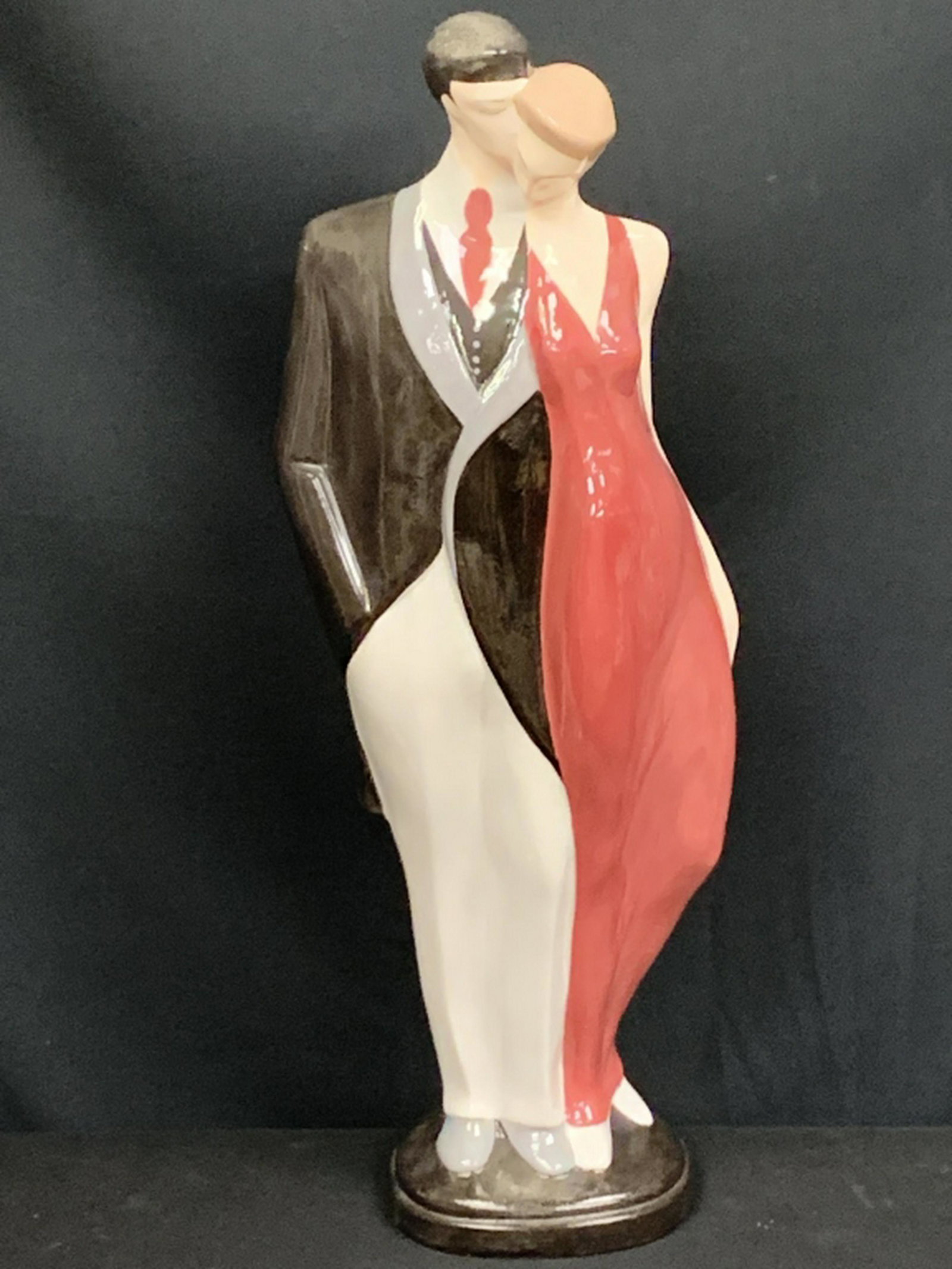 ART DECO MAN AND WOMEN SCULPTURE: Really cool Art Deco sculpture of a man and a woman. Signed by artist.23 1/2" high