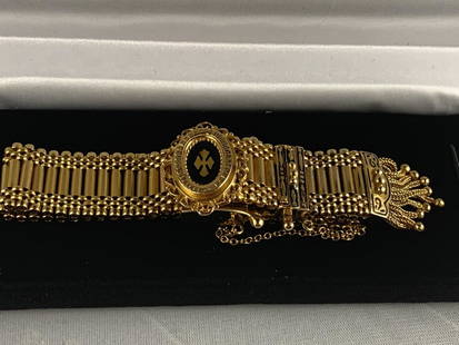 FABULOUS VINTAGE 14K GOLD WATCH: Simply stunning! This watch is a "must have" for any vintage watch collectors. Ver elegantly detailed with gold tasles on the strap and accented in black.49.7 g