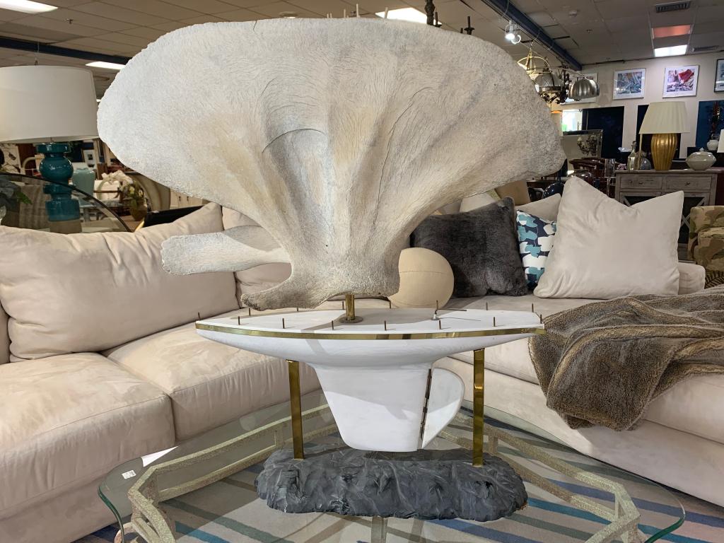 WHALE BONE VERTEBRA SCULPTURE WITH BOAT ON ROCK: Unusual and impressive oversized and awesome for the seafarer in your life. Great condition, gently preowned. Third party shipping required. Measurements 39" wide x 40" tall.