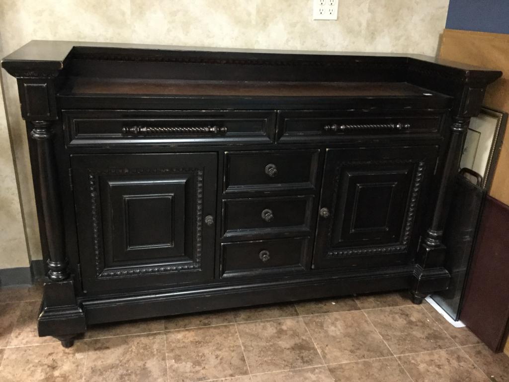 TOMMY BAHAMA BLACK WOOD BREAKFRONT SIDEBOARD: Classic Tommy Bahama breakfront with lots of storage. In great condition! Measurements 68" wide x 22" deep and 44" tall. Third party shipping required.