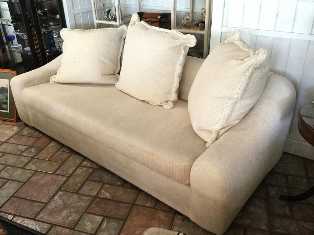 WHITE WOVEN CLOTH LOW BACK SOFT PILLOW BACK COUCH: Soft low set couch. 65" wide x 35" deep x 32" tall. Third party shipping required