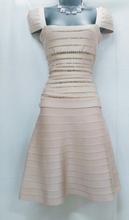 HERVE LEGER BANDAGE 2 PC COCKTAIL SKIRT TOP SET: Gorgeous Herve Leger 2 piece beige skirt set . Size XS and in excellent condition. Third party shipping required.
