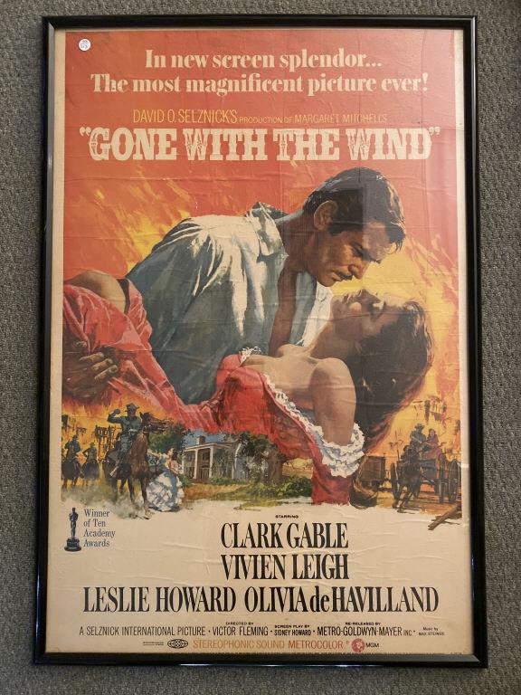 GONE WITH THE WIND MOVIE POSTER: "Gone With The Wind" movie poster in poster frame , mounted on posterboard in good condition. Measures approx 25"x 40"