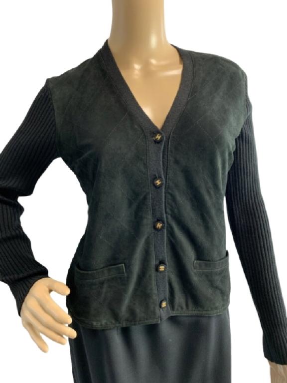 CHANEL BLACK WOOL SILK AND CASHMERE SWEATER SZ 44: Chanel black women's sweater made of wool, silk, and cashmere. Soft to the touch, and extremely comfortable. Gold Chanel logo on buttons. Size 44. 34"bust 23 1/2" L Good condition