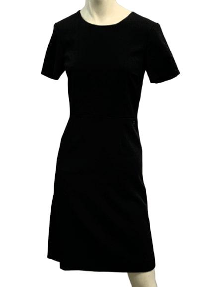CHANEL UNIFORM SIZE 36 BLACK DRESS: Authentic CHANEL uniform polyester/ spandex black dress with Chanel logo on hip. Rear zipper. Size 36 37" in length. Third Party Shipping Required. See Terms & Conditions for shipping recommendations.