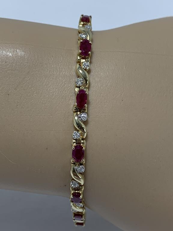 PRETTY 14K GOLD RUBY DIAMONDS TENNIS BRACELET: PRETTY and bold with genuine rubies and diamonds accented. Signed KF. Excellent condition. Gorgeous diamonds! 9 grams total weight.7" length.
