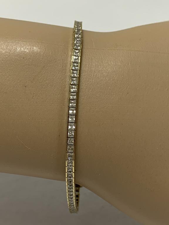 DELICATE SQUARE DIAMONDS 14K GOLD TENNIS BRACELET: Delicate and feminine and pretty. 14k yellow gold with channel set square cut diamonds. Gorgeous diamonds! Excellent condition,. 6 grams total weight.7" length