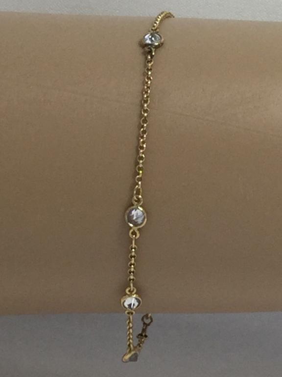 14K GOLD CRYSTAL ACCENT 9" ANKLET LARGE BRACELET: Beautiful and delicate in 14k yellow gold with crystal accents. Would fit as an anklet or a large bracelet. Excellent condition.3.4 grams total weight. 9" length