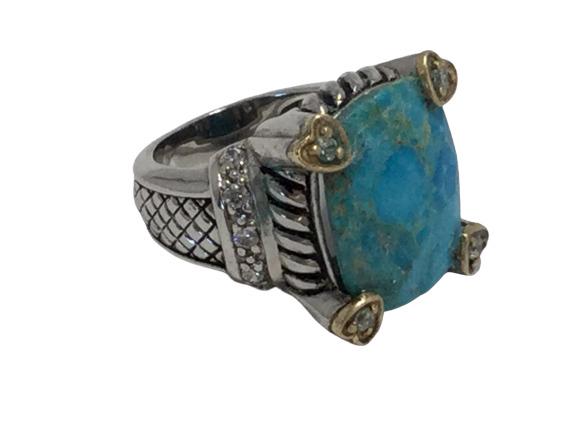 STERLING SILVER 14K HEART DETAIL TURQUOISE NF RING: Signed NF and stamped 925 and 14K. Bold turquoise stone right with crystal center heart accents and 14k gold trimwork. In the style of John Hardy, stunning and in great condition! 11.3 grams total wei