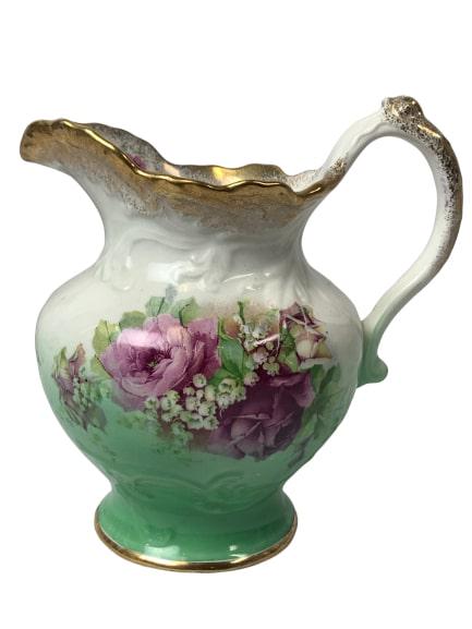 "LAVENDER ROSES" WATER PITCHER BY ANCHOR POTTERY: Pitcher Measures 8" Tall with Lavender roses flowers Pattern with Gold Leaf Design. Marked on Bottom with the pottery mark belonging to Anchor Pottery of Trenton, NJ.
