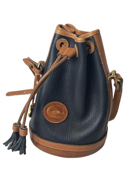 DOONEY & BOURKE BLACK LEATHER DRAWSTRING HANDBAG: Vtg Dooney & Bourke Small Black All Weather Leather Drawstring Handbag, #922It is a bucket style satchel, with a draw string top closureIt is made of full grain, all-weather leatherThe shoulder strap