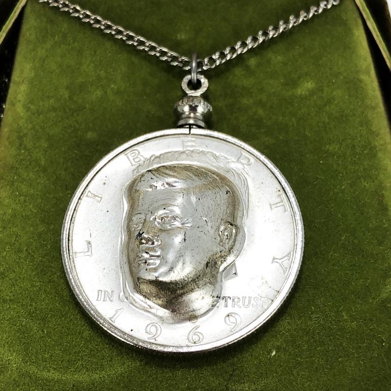 LIBERTY HALF DOLLAR NECKLACE EMBOSSED JFK: This is a silver necklace with a Liberty Half Dollar pendant.The necklace is 24"