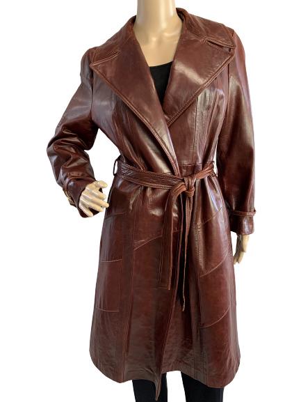 VINTAGE 70'S SKIN GEAR BURGUNDY LEATHER MAX COAT L: Gorgeous leather maxi coat by "Skin Gear" and in amazing vintage condition. Burgundy leather with belt tie and wide lapel detail. Stunning. Fits size large with measurements 42" bust, 44" length and 2