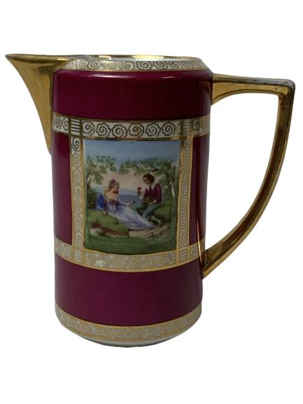 ROYAL VIENNA MILK CREAMER "COURTING COUPLE": Vintage Porcelain Creamer with Images of Courting Couples.Royal Vienna style with the Blue Beehive/Shield MarkPrinted on bottom, "Hermann Holzner/ Karlsbad/ "Glaspalast"Rich hunter green bottom with g